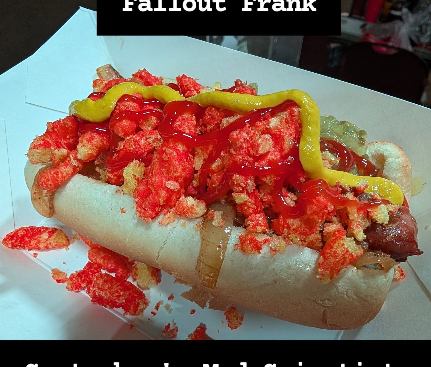 Meet the Mad scientist for September, The Fallout Frank. Queso, bacon, green relish, crumbled Cheetos, yellow mustard. Glowing from the ashen wastelands with radioactive goodness.