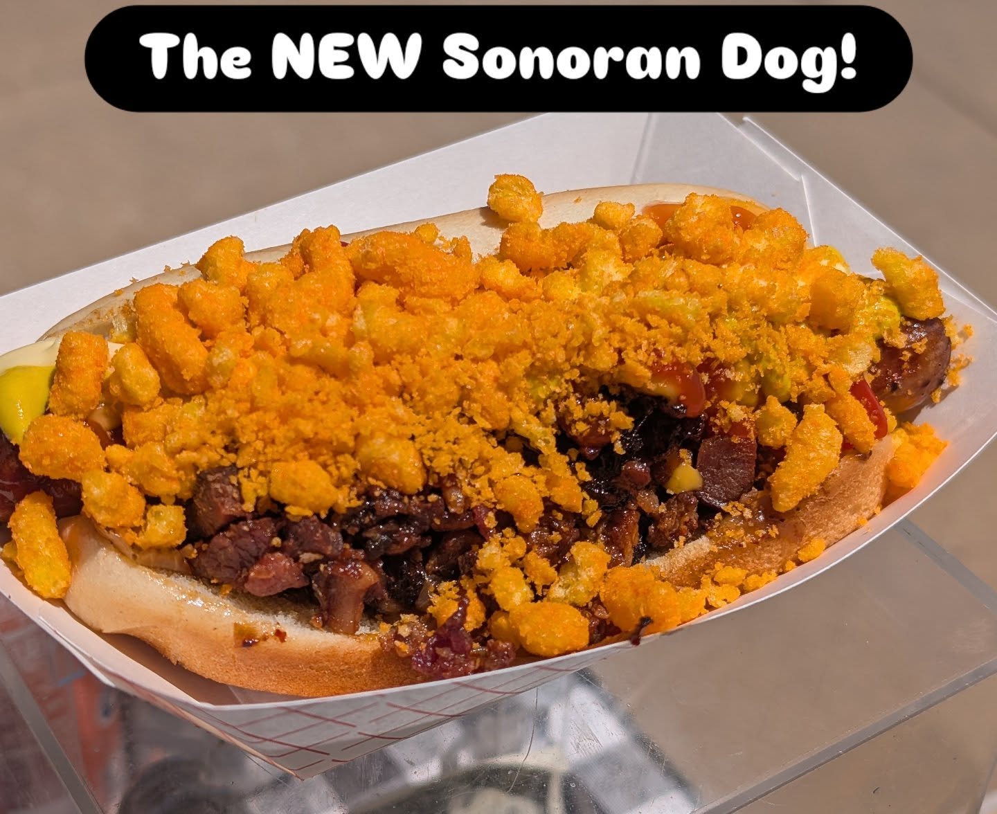 When we introduced our Sonoran dog, one of the largest complaints was the dog fell apart before you could really eat it. It was a soggy dog. I decided to go back to the drawing board and attempt to repair some of those issues.
So our new Sonoran dog still has queso bacon and onion, ketchup, mustard and mayo, jalapenos, but now it's coated with a generous topping of crushed crunchy Cheetos. This really helped sop up a lot of that moisture and kept the dog together for most of the eating. 😂
We will be outside @transportbrewery_shawnee Tuesday, Wednesday and Thursday this week.
Tuesday: Music Bingo (movie music) 5-9pm
Wednesday: Geeks who drink trivia 5-9pm
Thursday: Shawnee Moonlit Market 4-8pm
